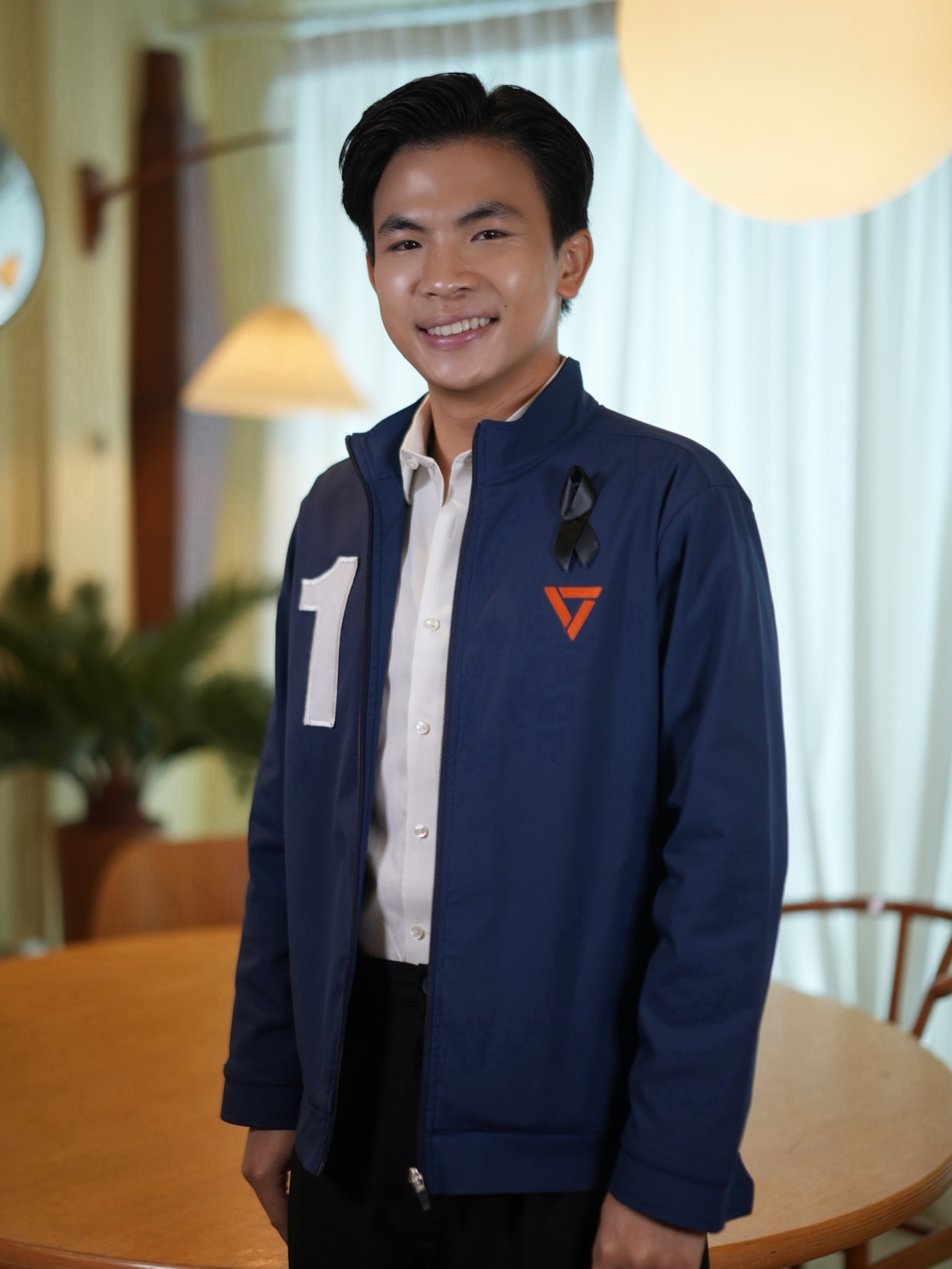 Thanapat in a People’s Party jacket during the 2026 campaign